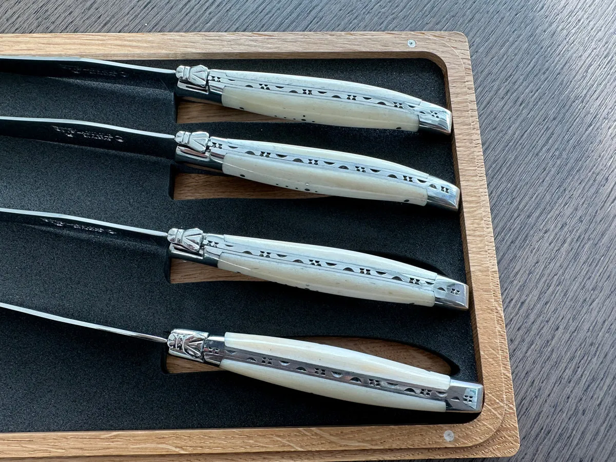 Laguiole en Aubrac Handcrafted 4-Piece Steak Knife Set with Zebu Bone Handles, Polished Bolsters